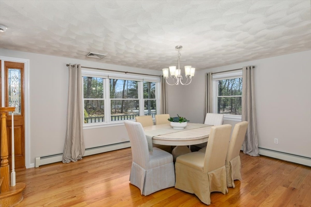 270 Salem Road Dracut, MA 01826 - Photo 8 of 42 a view of a dining room with furniture window and wooden floor