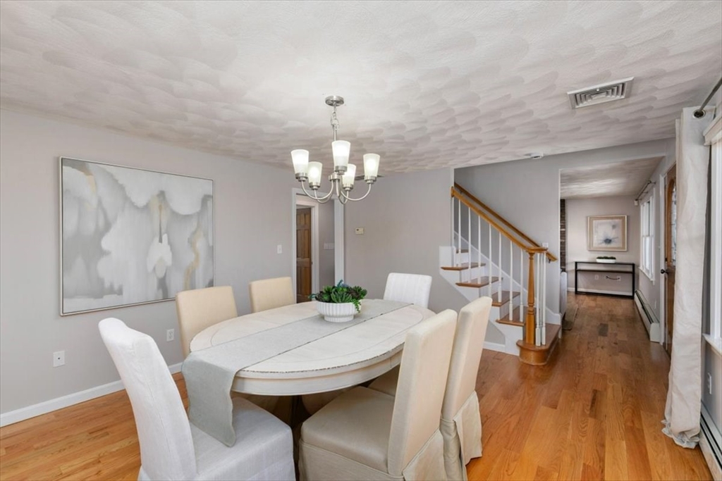 270 Salem Road Dracut, MA 01826 - Photo 9 of 42 a view of a dining room with furniture and wooden floor