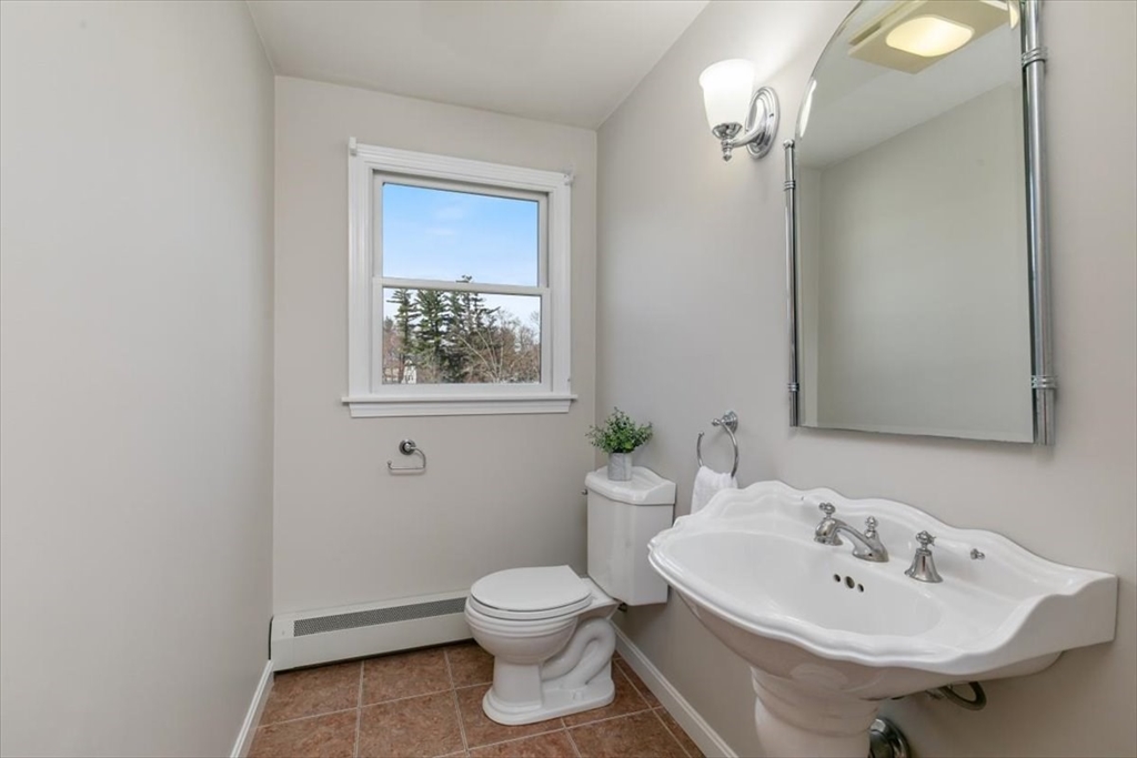 270 Salem Road Dracut, MA 01826 - Photo 10 of 42 a bathroom with a sink mirror and toilet