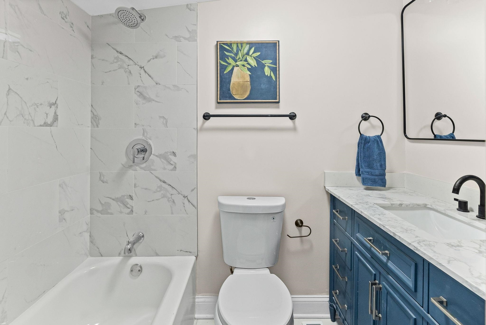 101 Marilyn Avenue Centralia, IL 62801 - Photo 16 of 34 a bathroom with a granite countertop toilet sink and mirror