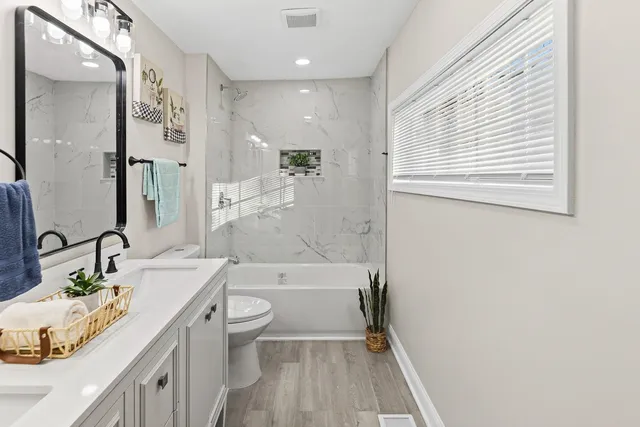a kitchen with stainless steel appliances a refrigerator and cabinets