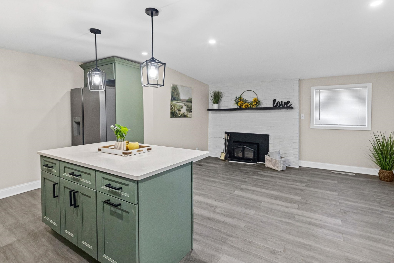 101 Marilyn Avenue Centralia, IL 62801 - Photo 26 of 34 a view of kitchen island with wooden floor and fireplace
