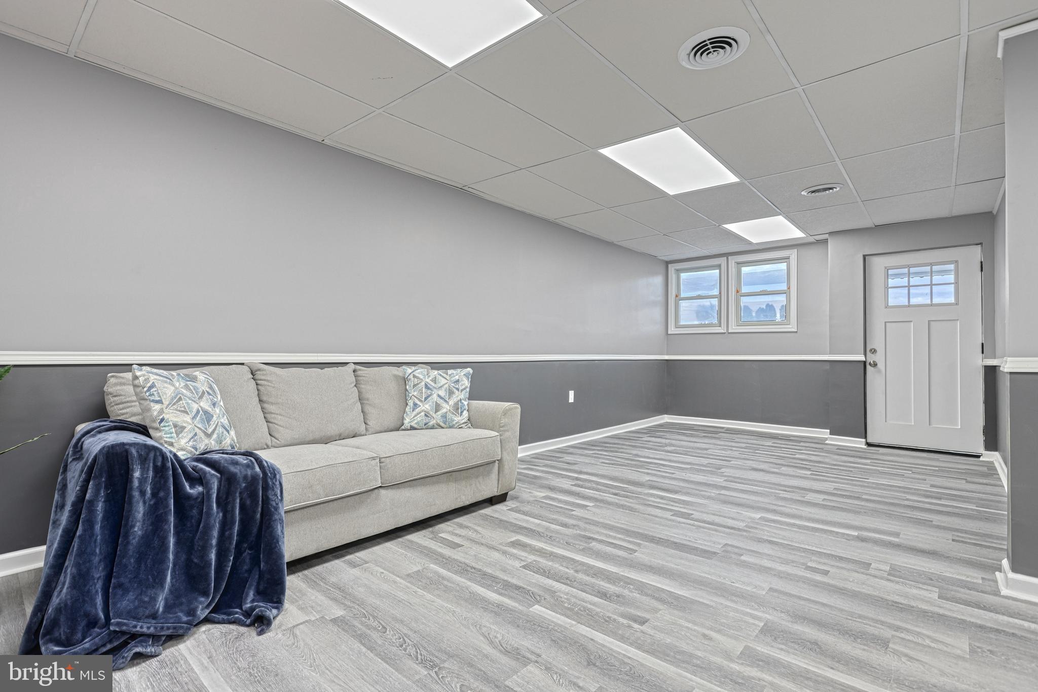 301 State Street Steelton, PA 17113 - Photo 11 of 44 a living room with furniture a ceiling fan and a rug