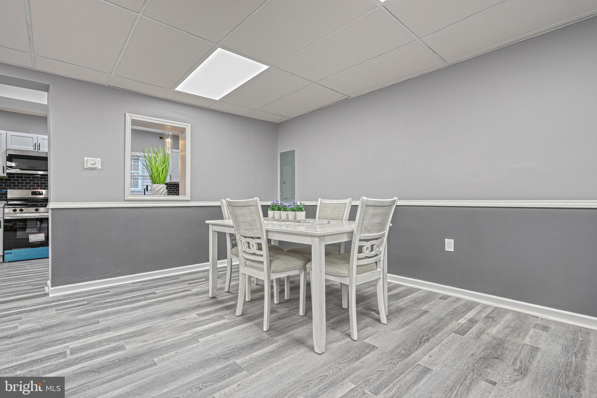 301 State Street Steelton, PA 17113 - Photo 15 of 44 a view of a dining room with furniture and wooden floor