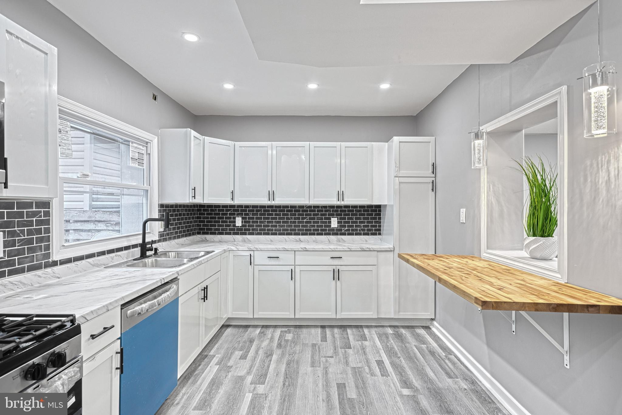 301 State Street Steelton, PA 17113 - Photo 22 of 44 a kitchen with a sink stove and cabinets