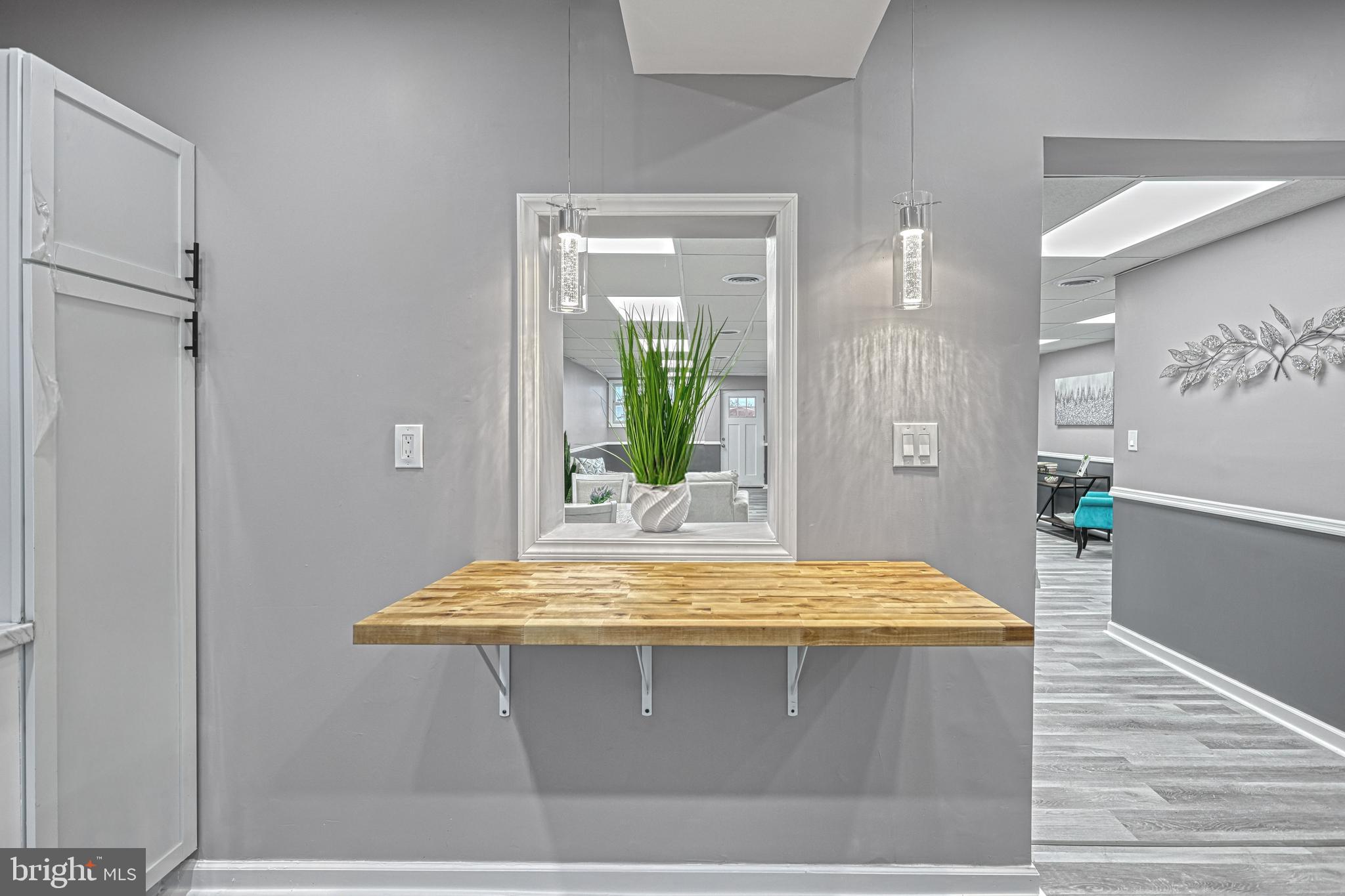 301 State Street Steelton, PA 17113 - Photo 26 of 44 a room with kitchen island and wooden floor