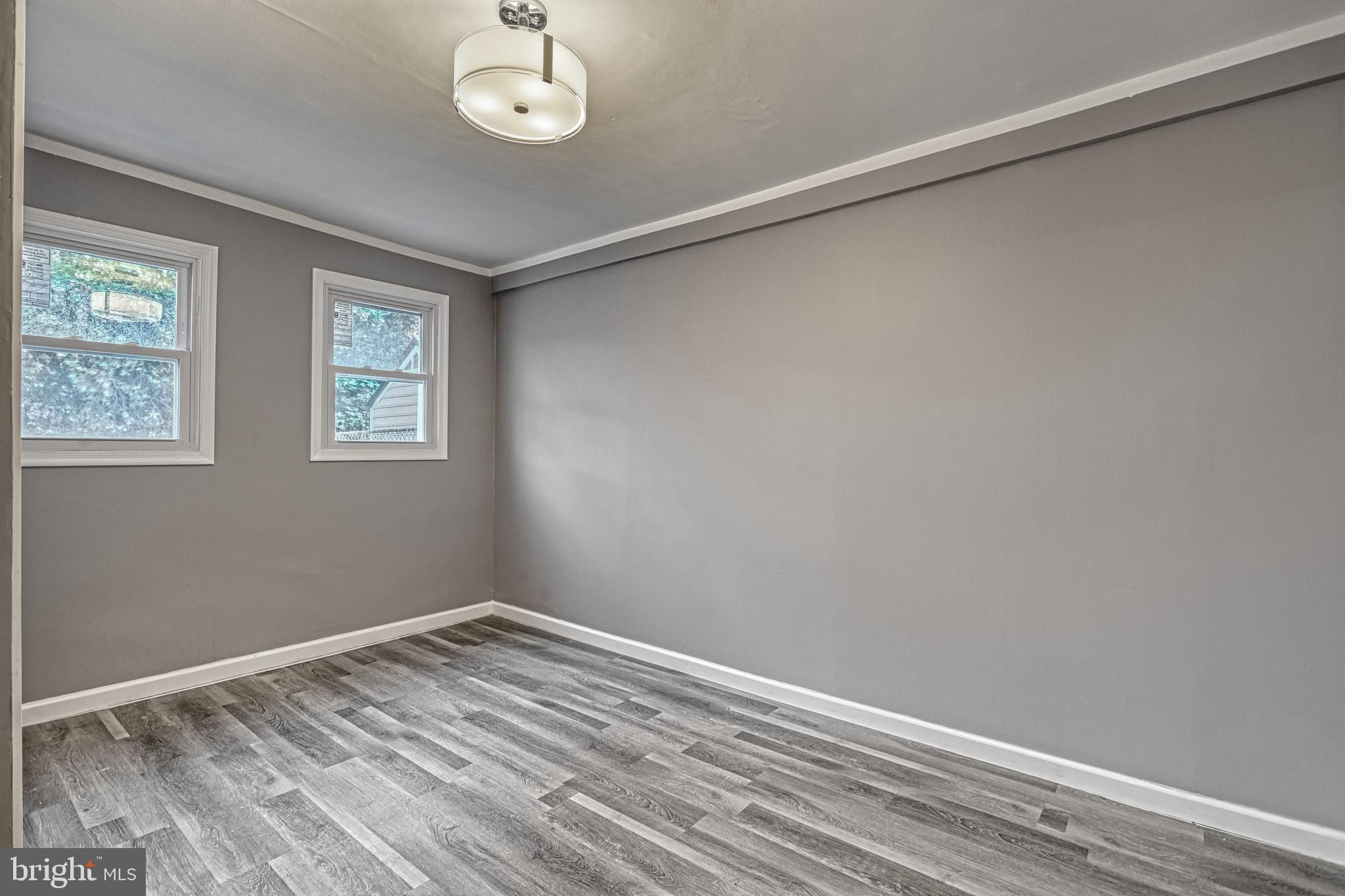 301 State Street Steelton, PA 17113 - Photo 31 of 44 a view of a room with wooden floor and windows