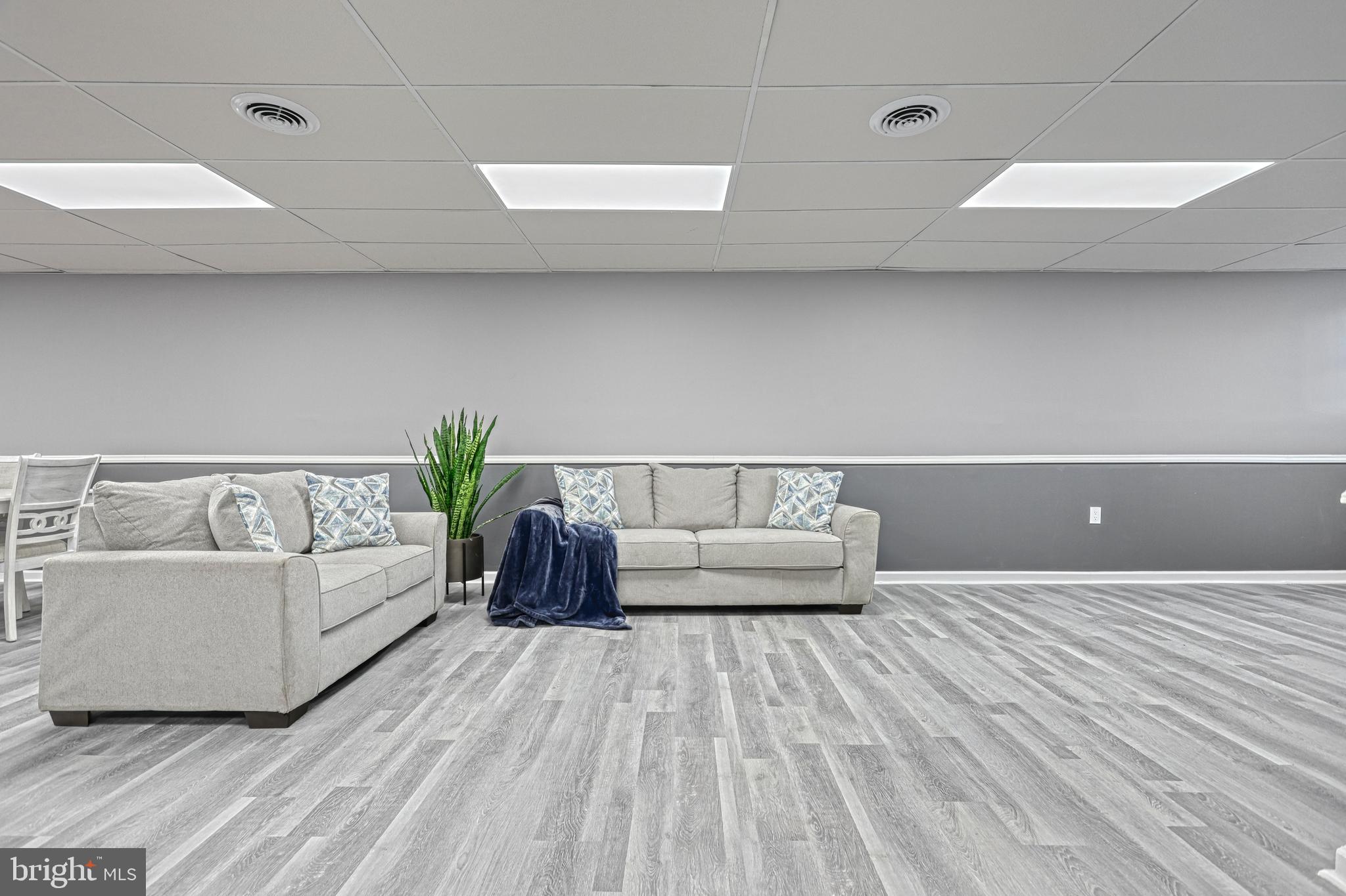 301 State Street Steelton, PA 17113 - Photo 9 of 44 a living room with a couch and a wooden floor
