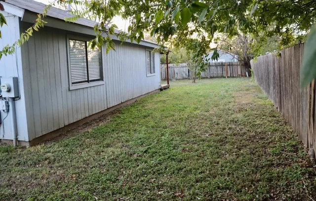 a backyard of a house with lots of green space