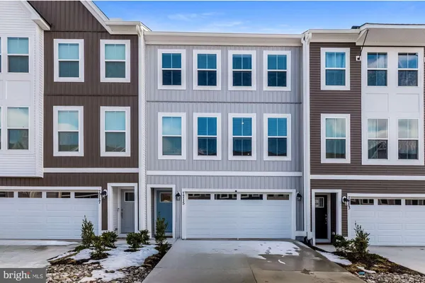 a front view of a building with a parking space