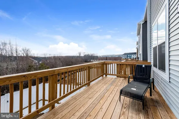 a view of roof deck with patio