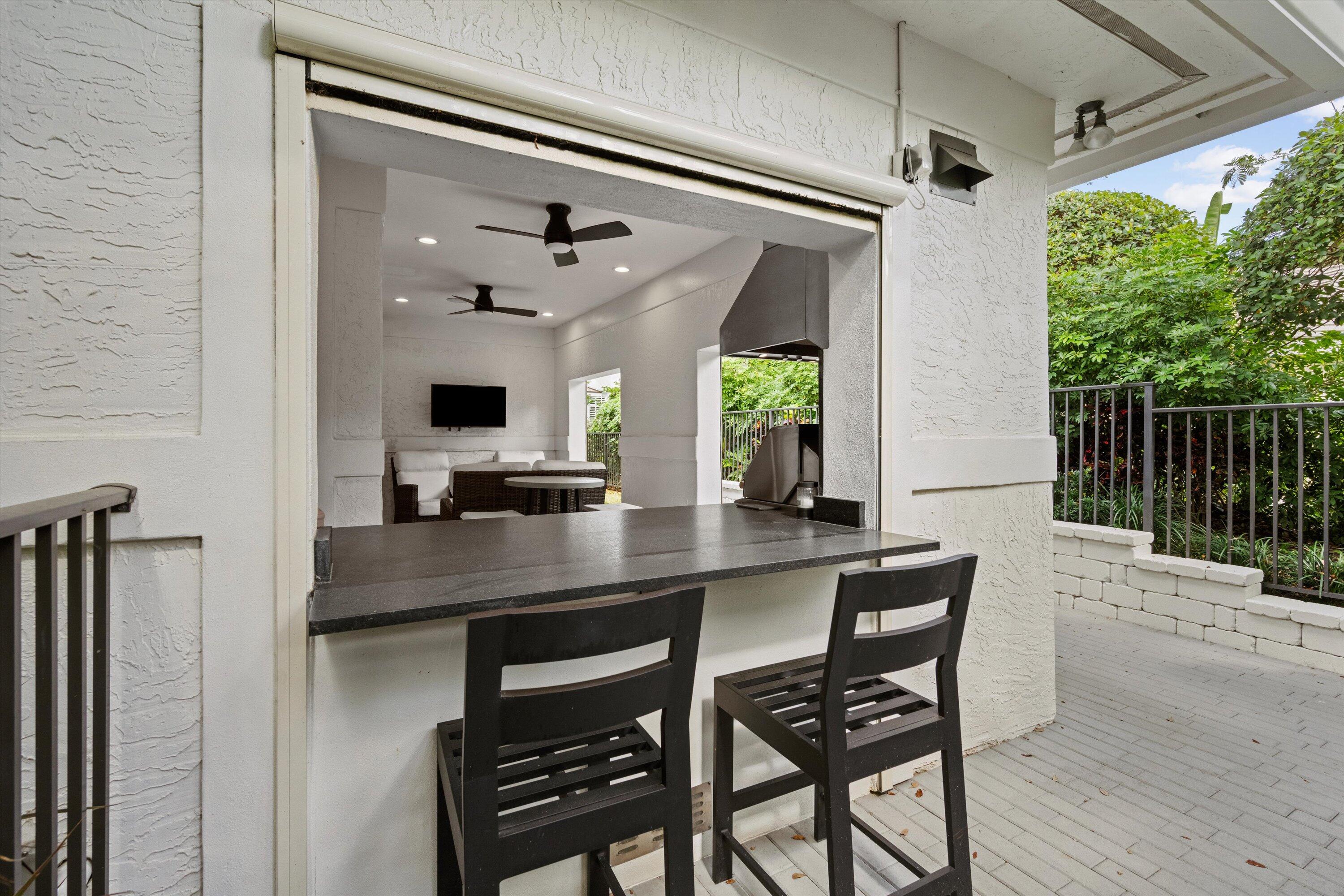 106 Toteka Circle Jupiter, FL 33458 - Photo 23 of 27 a view of kitchen island with furniture and windows