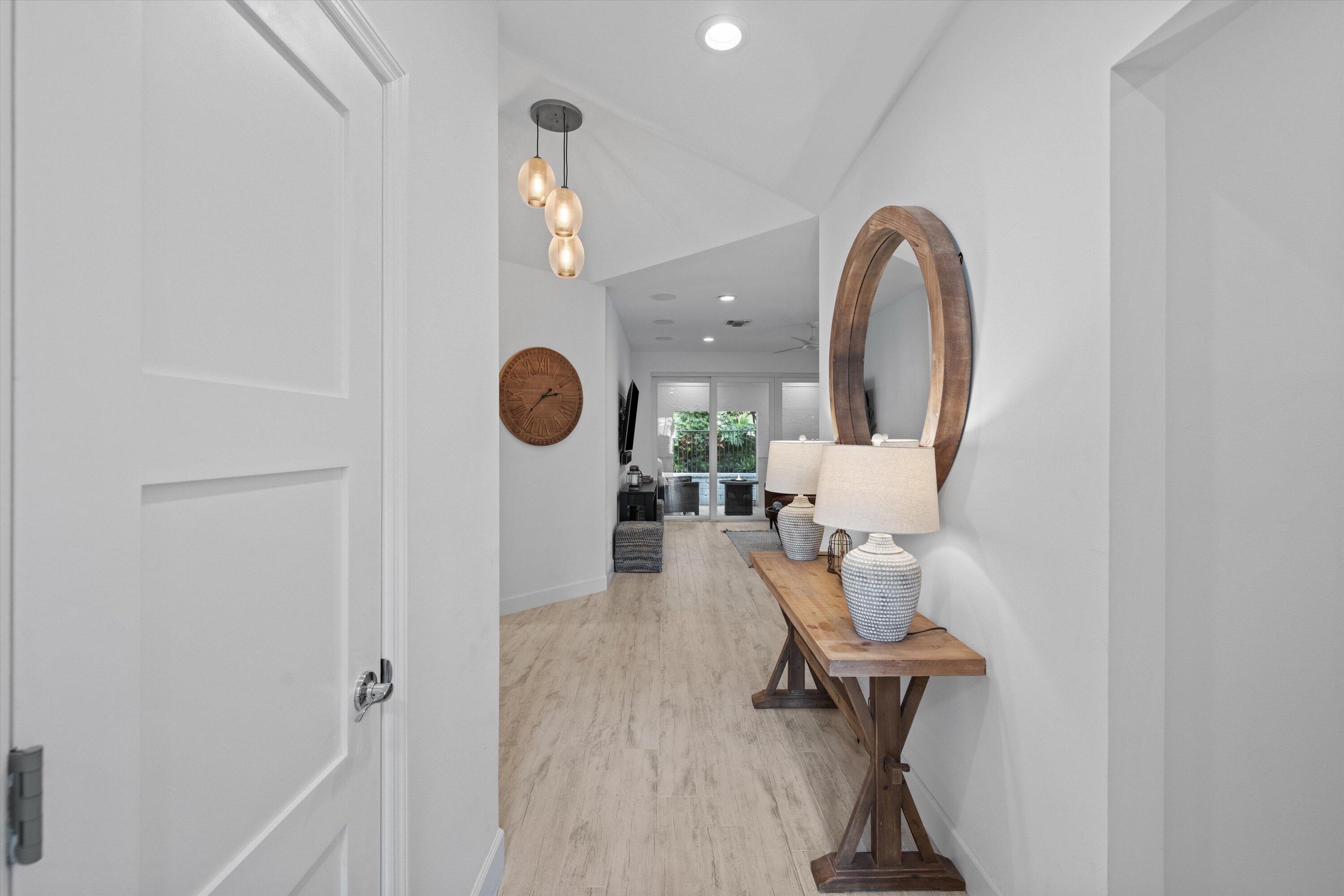 106 Toteka Circle Jupiter, FL 33458 - Photo 4 of 27 a view of a room with wooden floor and furniture