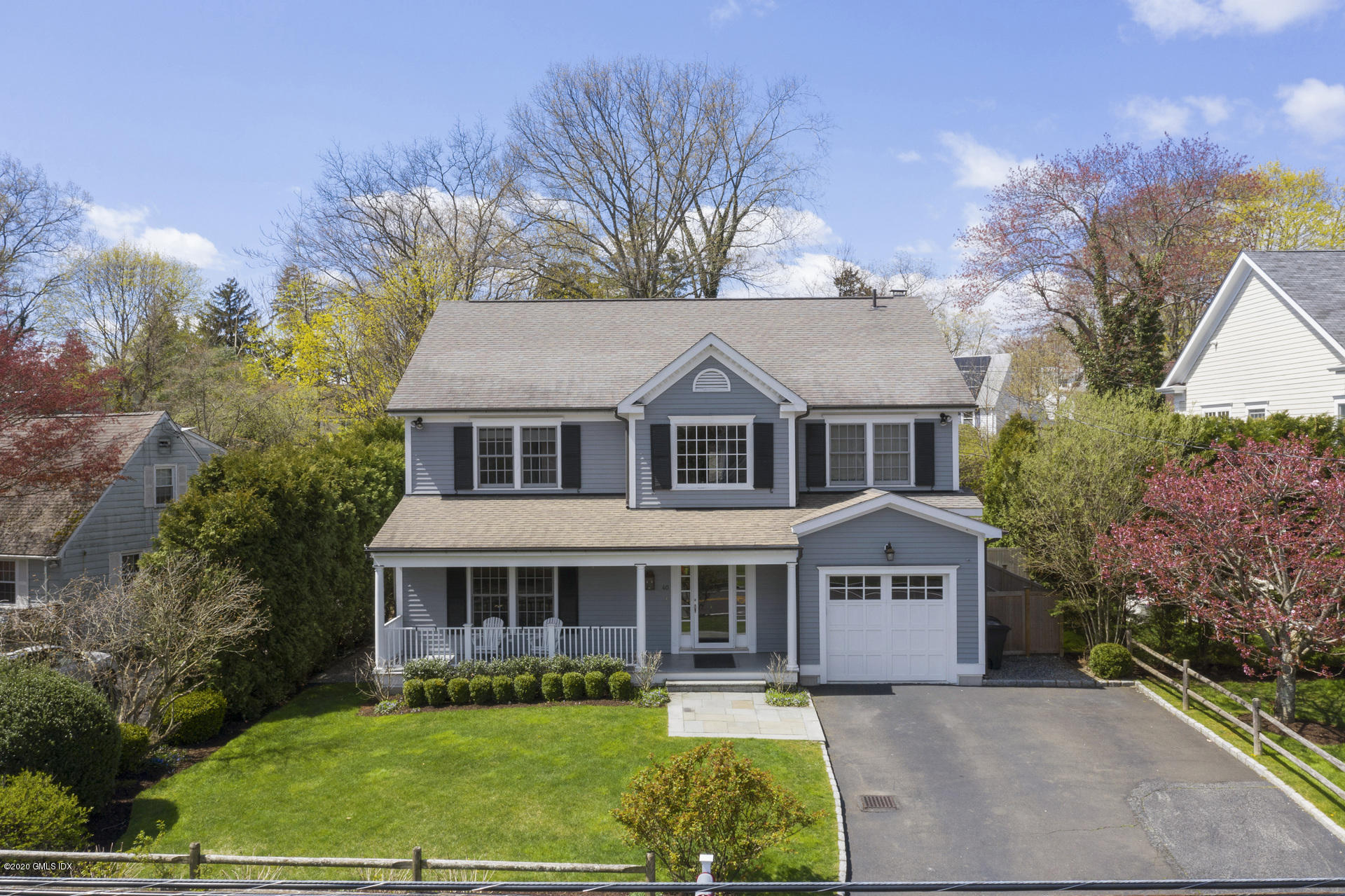 40 Riverside Lane Riverside, CT 06878 - Photo 1 of 45 a front view of a house with garden