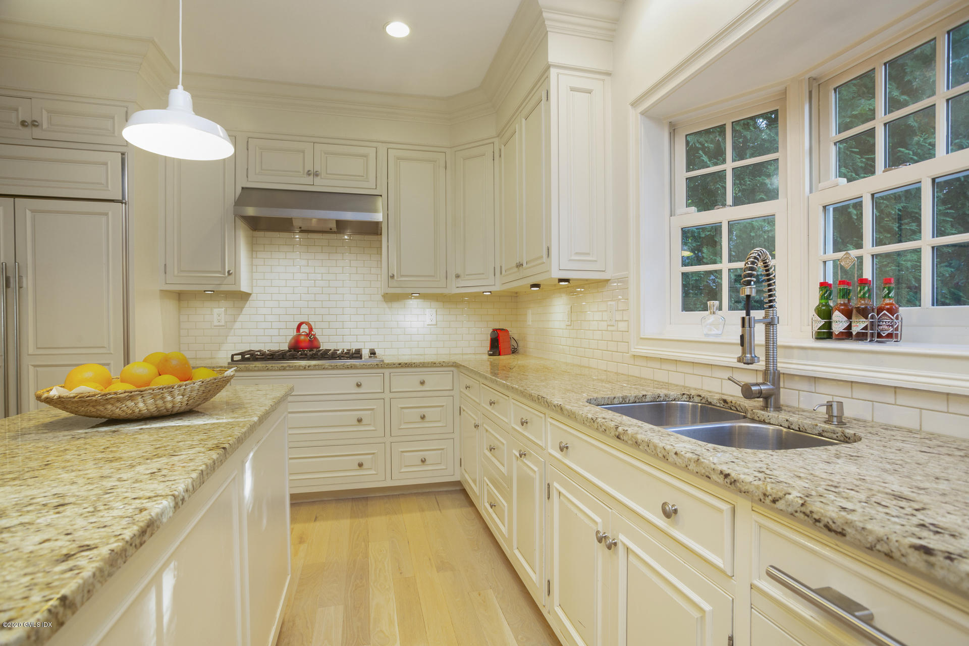 40 Riverside Lane Riverside, CT 06878 - Photo 15 of 45 a kitchen with granite countertop a sink and a stove