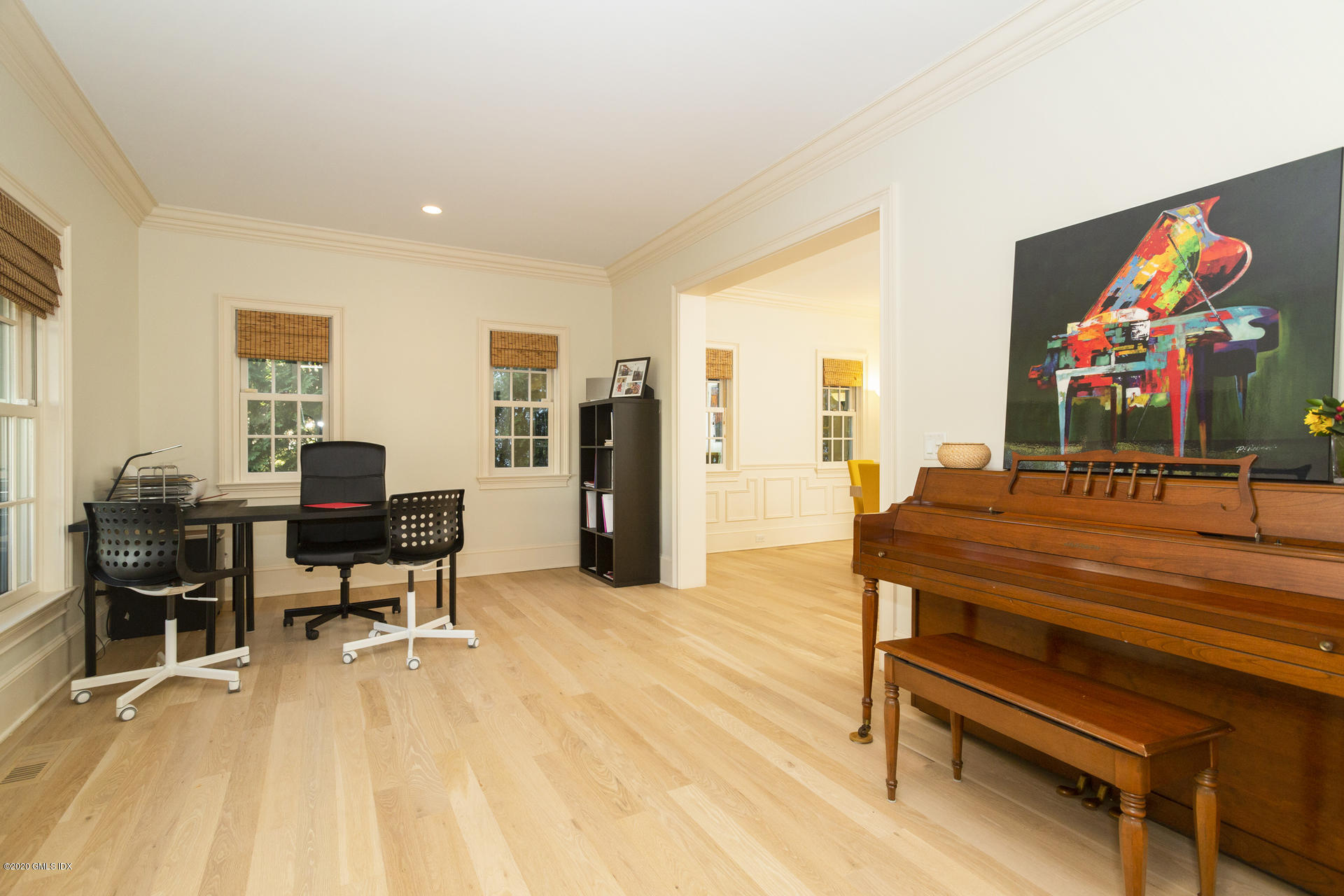 40 Riverside Lane Riverside, CT 06878 - Photo 19 of 45 a living room with furniture a piano and a flat screen tv