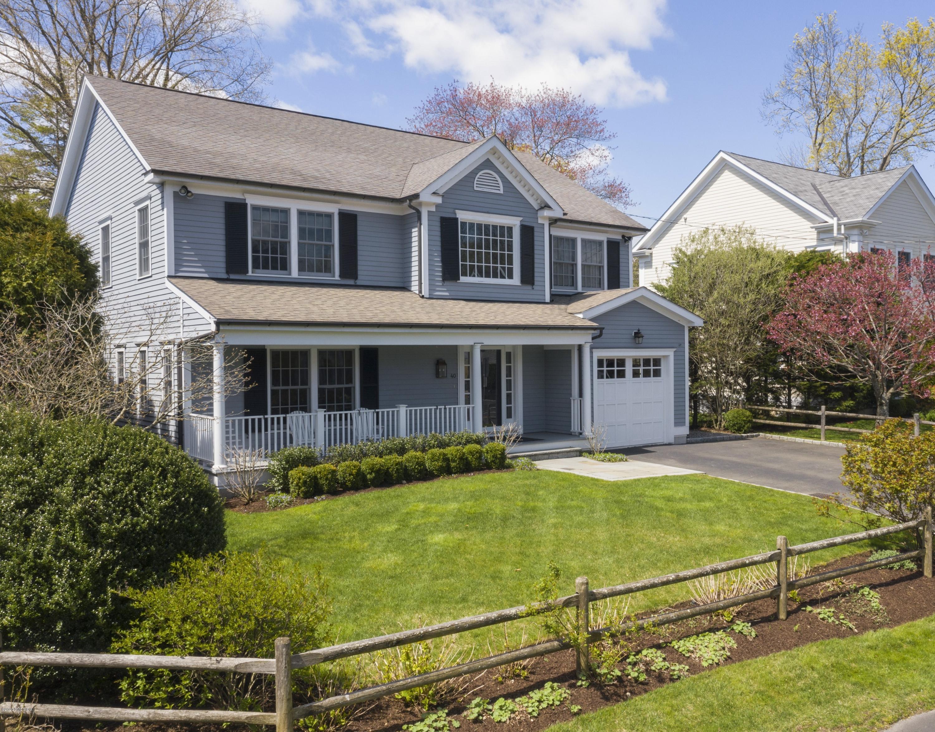 40 Riverside Lane Riverside, CT 06878 - Photo 2 of 45 a view of a house with pool in front of it