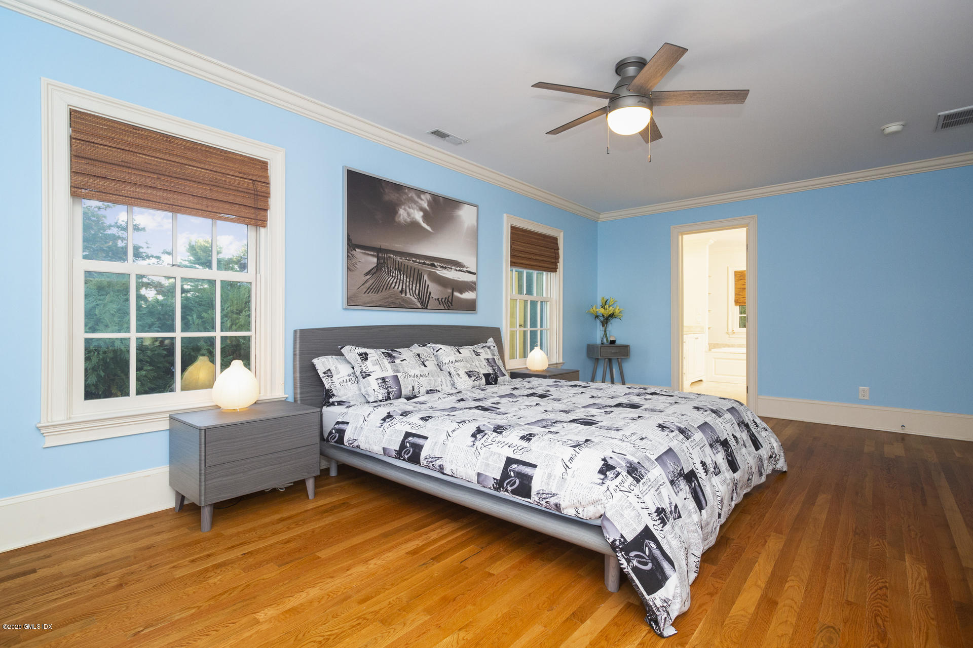 40 Riverside Lane Riverside, CT 06878 - Photo 23 of 45 a bedroom with a bed and a large window