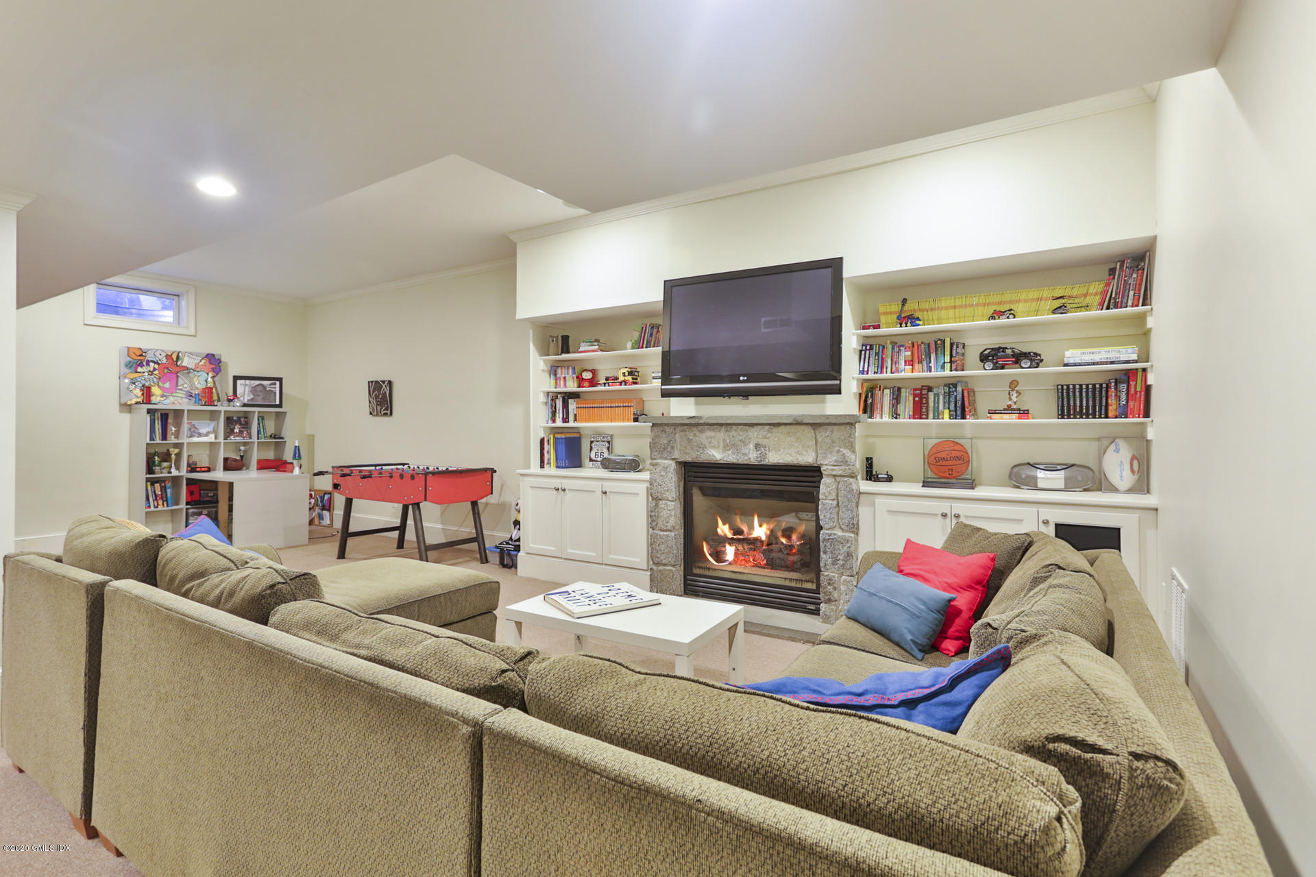 40 Riverside Lane Riverside, CT 06878 - Photo 34 of 45 a living room with furniture and a flat screen tv