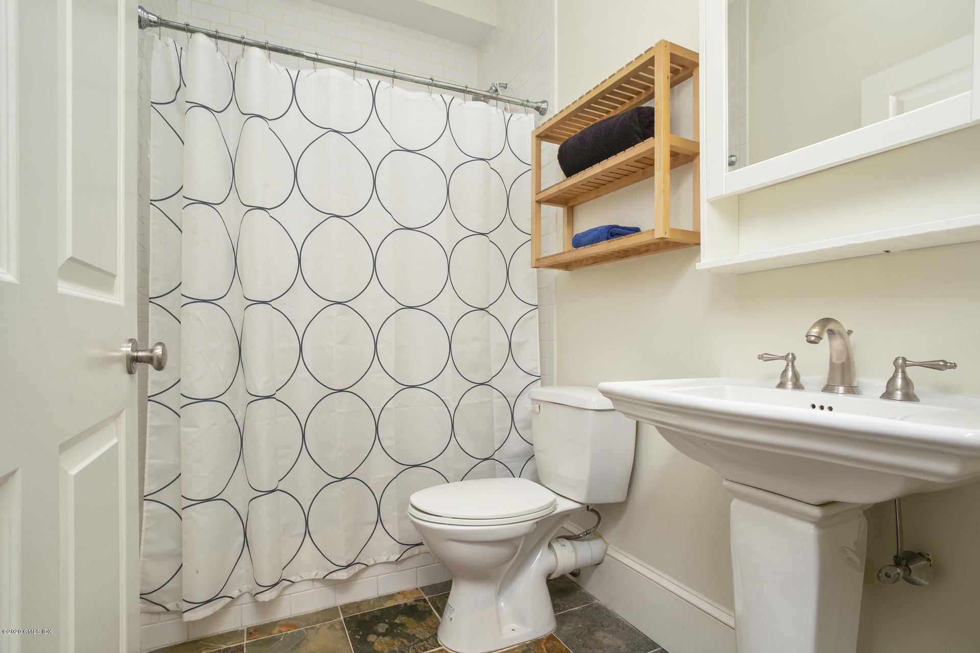 40 Riverside Lane Riverside, CT 06878 - Photo 37 of 45 a bathroom with a sink and a toilet