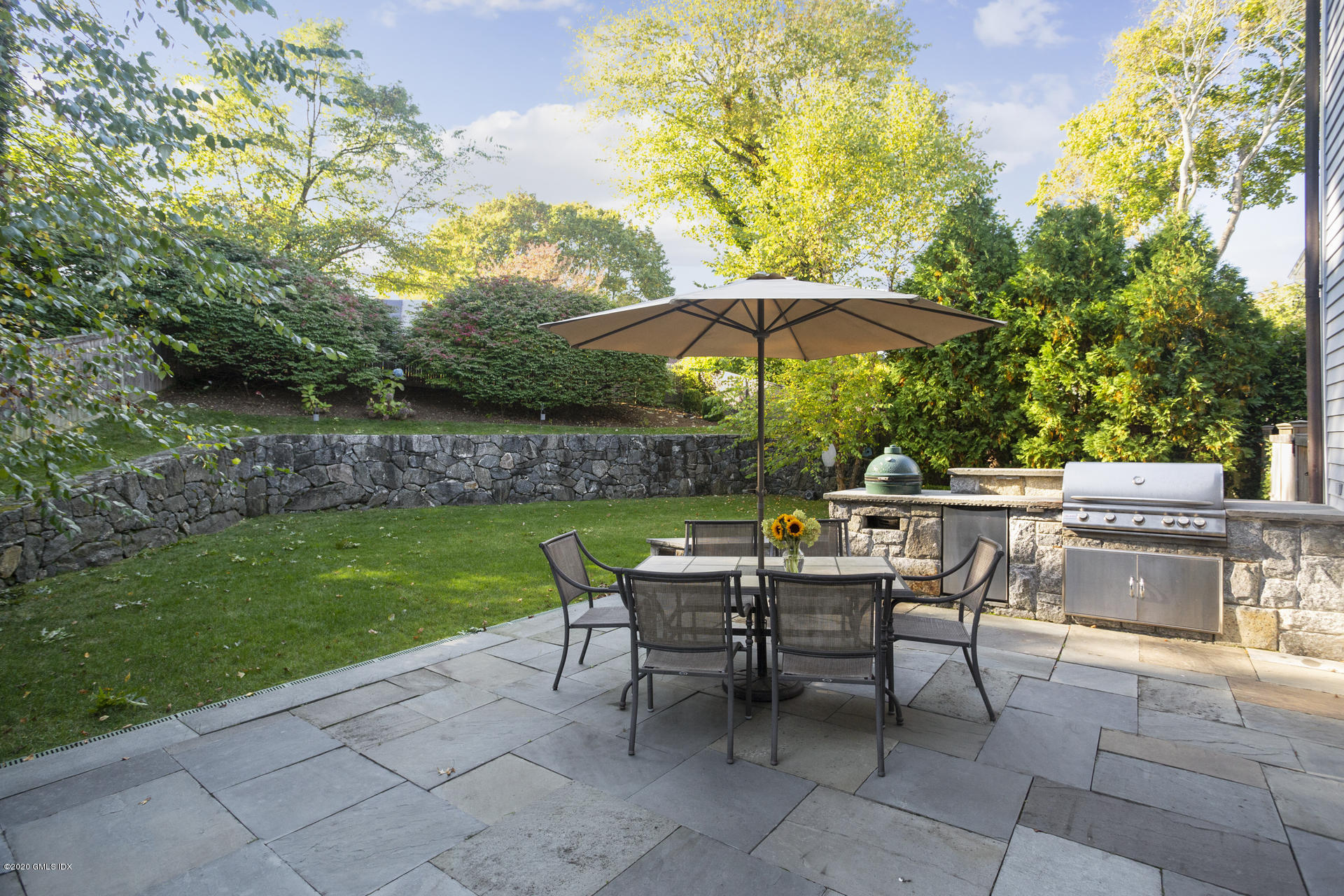 40 Riverside Lane Riverside, CT 06878 - Photo 6 of 45 a view of backyard with outdoor seating a patio and plants
