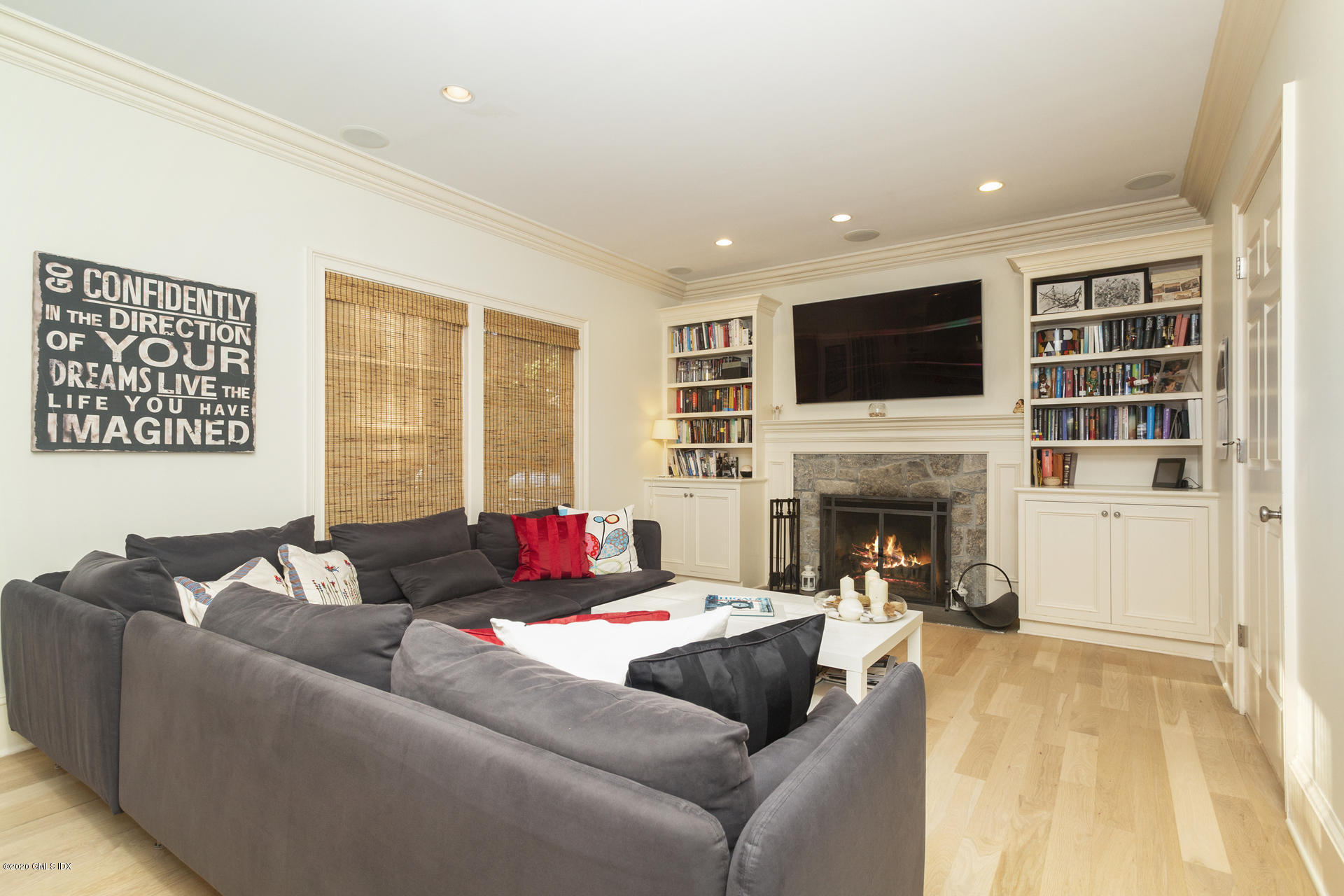 40 Riverside Lane Riverside, CT 06878 - Photo 9 of 45 a living room with furniture fireplace and flat screen tv