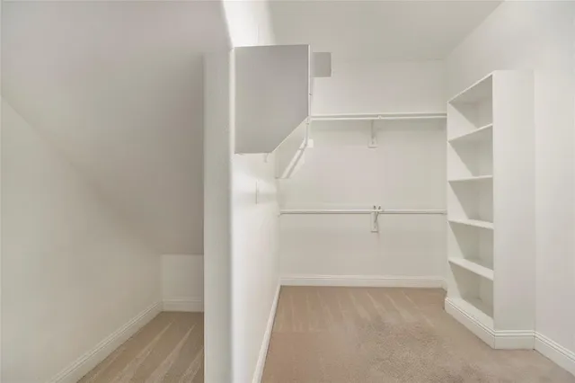 a spacious bathroom with a double vanity sink and mirror