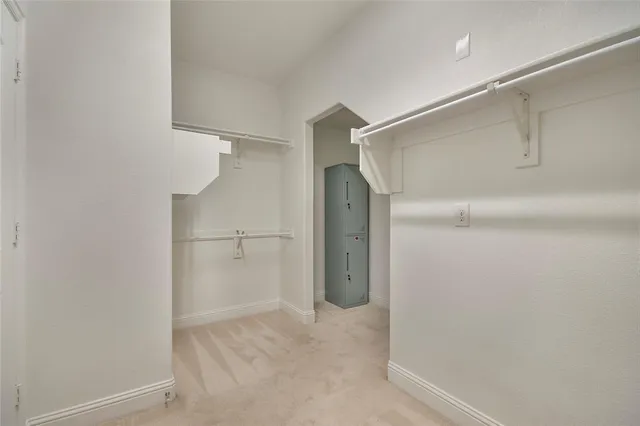 a view of an empty walk in closet