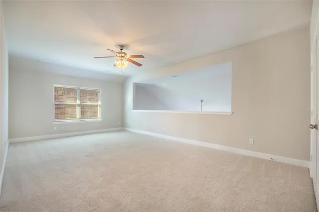 a bathroom with a shower and a glass door