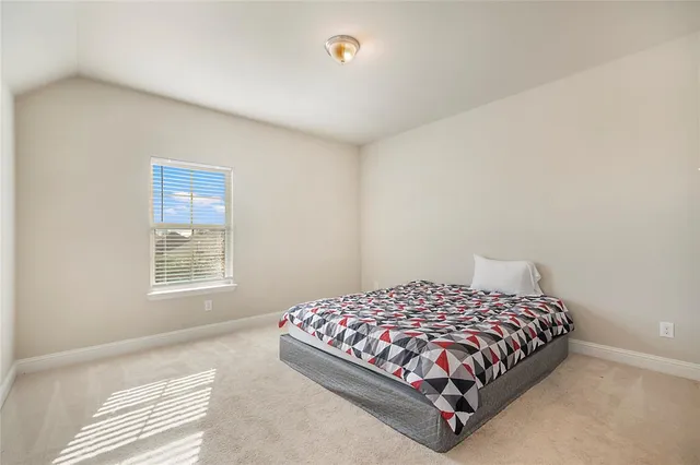 a view of storage and utility room with window