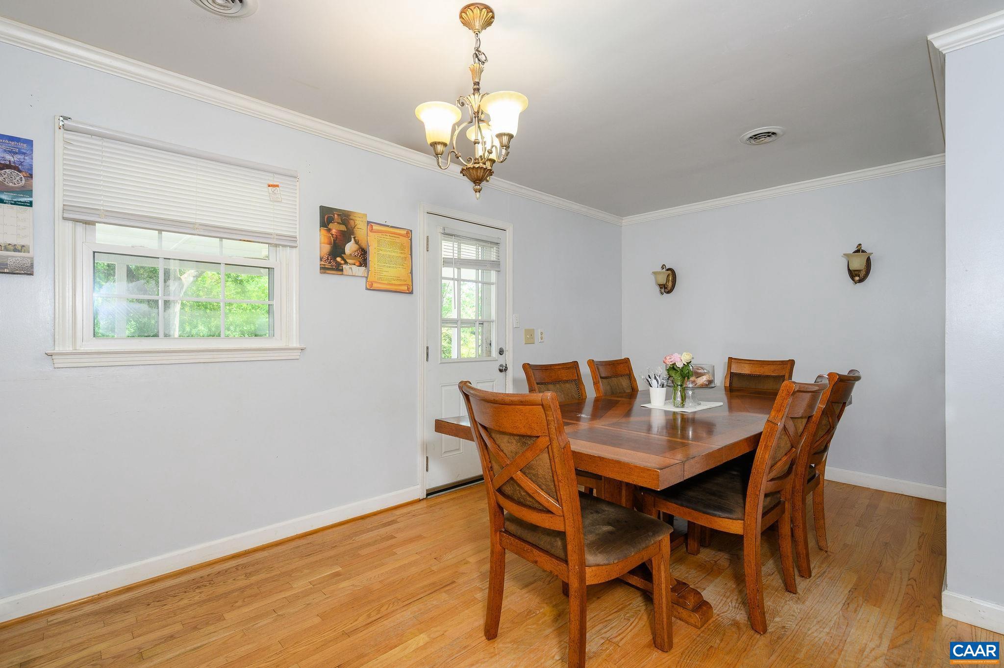 2806 Brookmere Road Charlottesville, VA 22901 - Photo 6 of 19 a view of a dining room with furniture and wooden floor