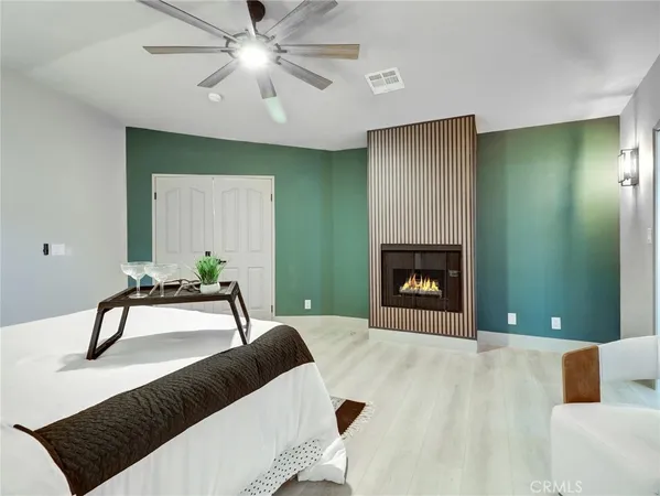 a bedroom with a bed and a fireplace