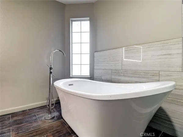 a white bath tub sitting in a bathroom