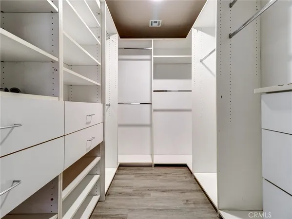 a view of an empty walk in closet