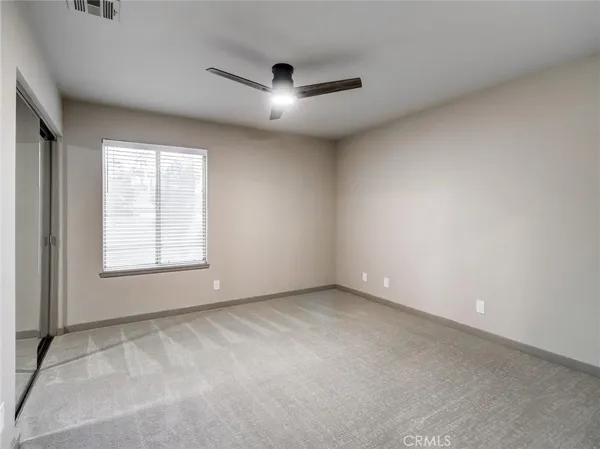 an empty room with a empty space and windows