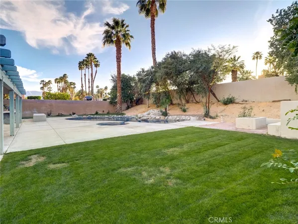 a view of a backyard of the house