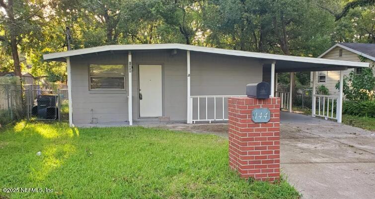 144 Spring Street Jacksonville, FL 32254 - Photo 1 of 7 a front view of a house with garden