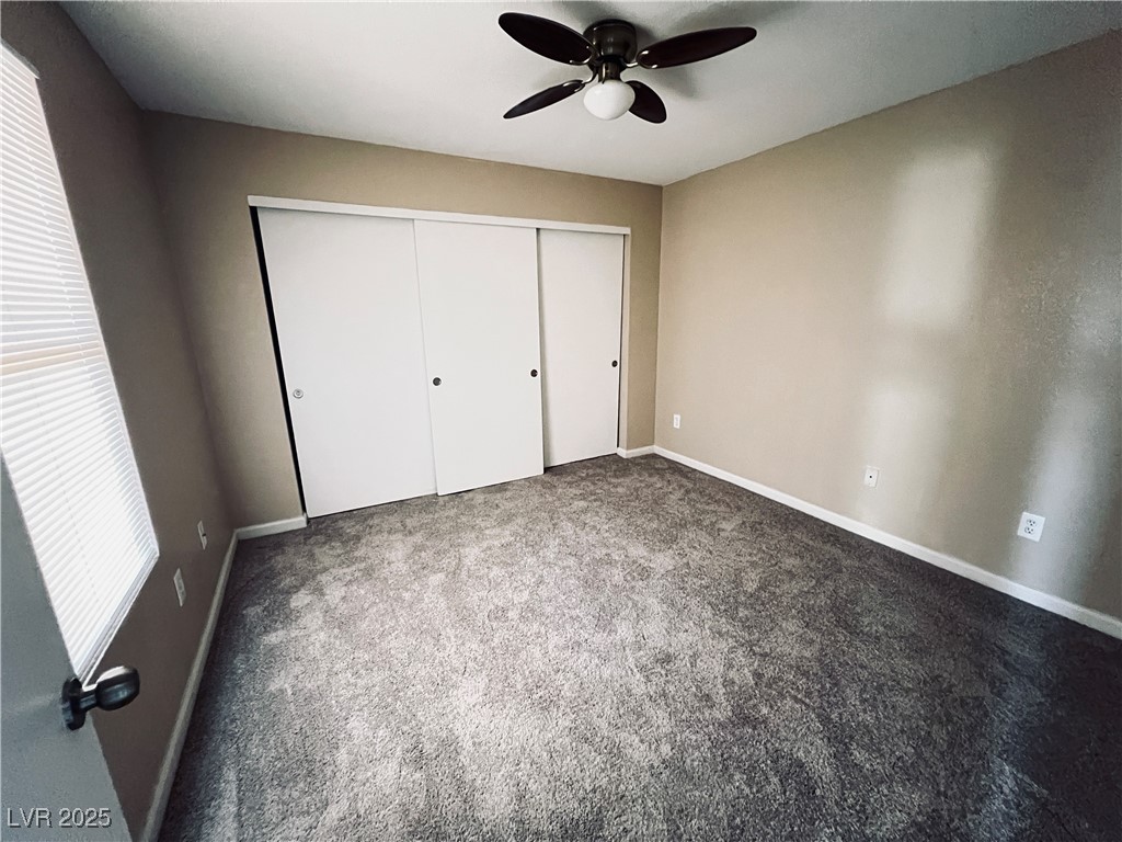 8101 West Flamingo Road, Unit 2161 Las Vegas, NV 89147 - Photo 14 of 21 Unfurnished bedroom featuring carpet flooring, a closet, and ceiling fan