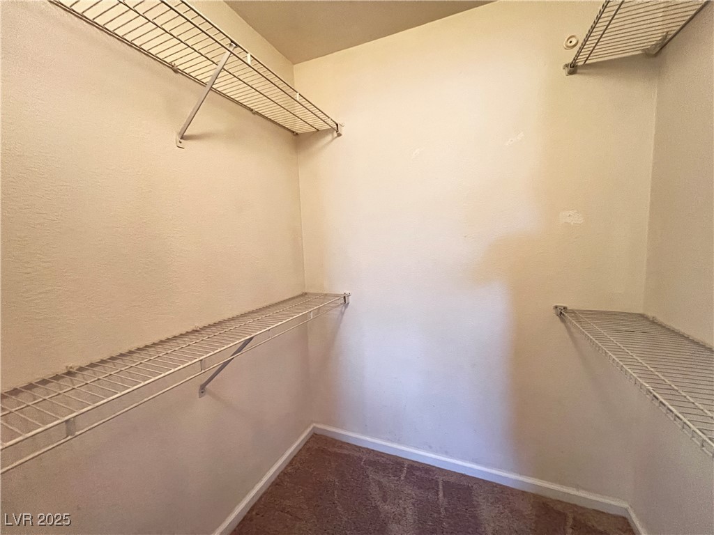 8101 West Flamingo Road, Unit 2161 Las Vegas, NV 89147 - Photo 17 of 21 Spacious closet with dark colored carpet