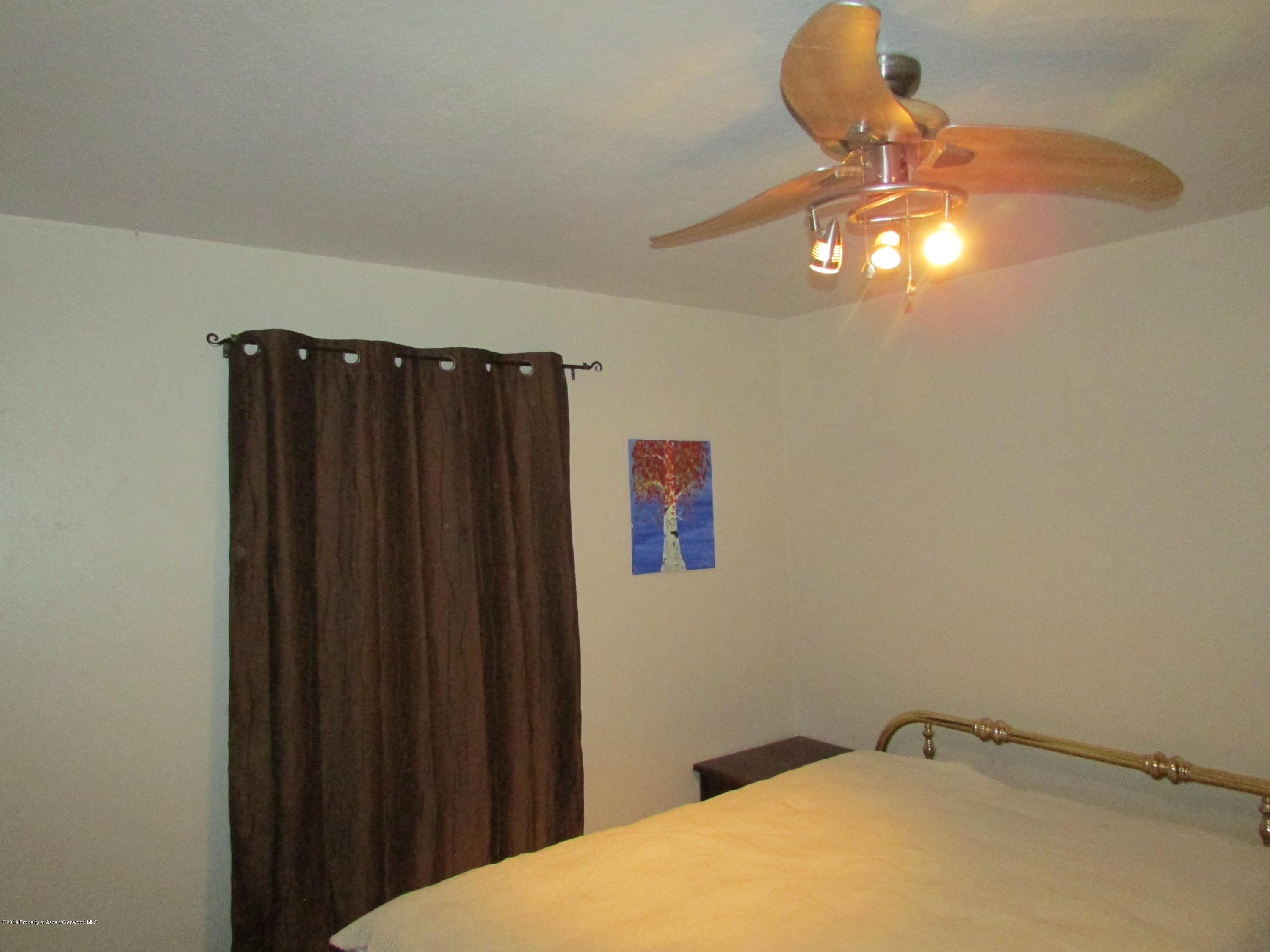 819 West 3rd Street Rifle, CO 81650 - Photo 11 of 17 a view of a chandelier fan and closet in a room