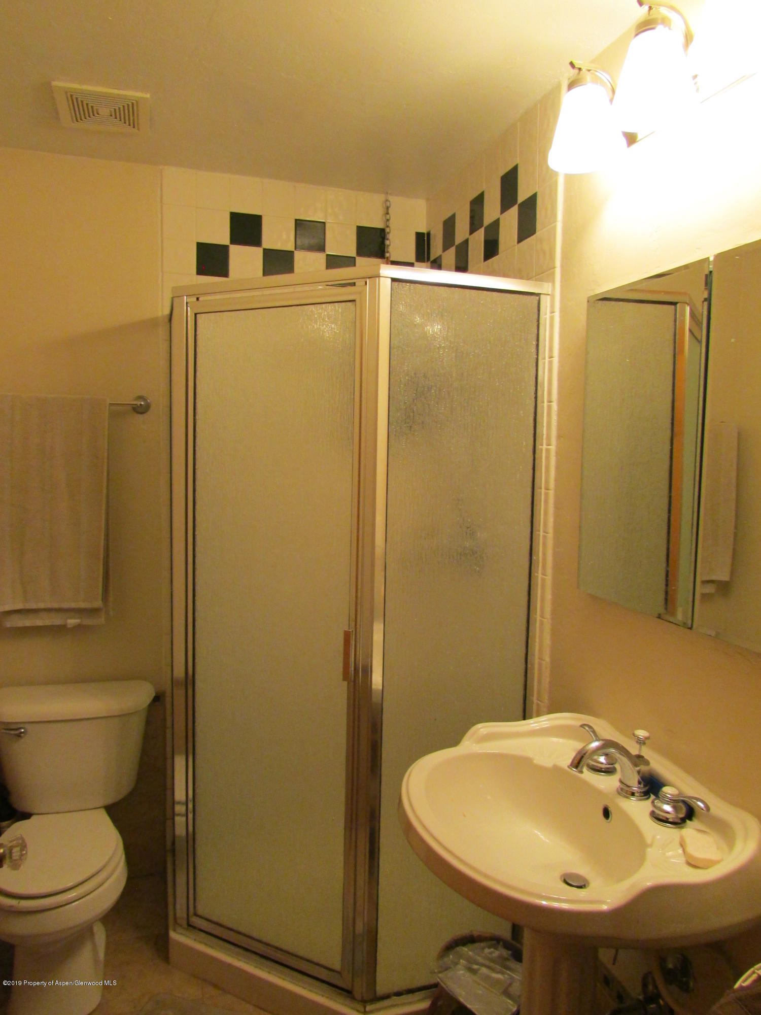 819 West 3rd Street Rifle, CO 81650 - Photo 14 of 17 a bathroom with a sink and a toilet