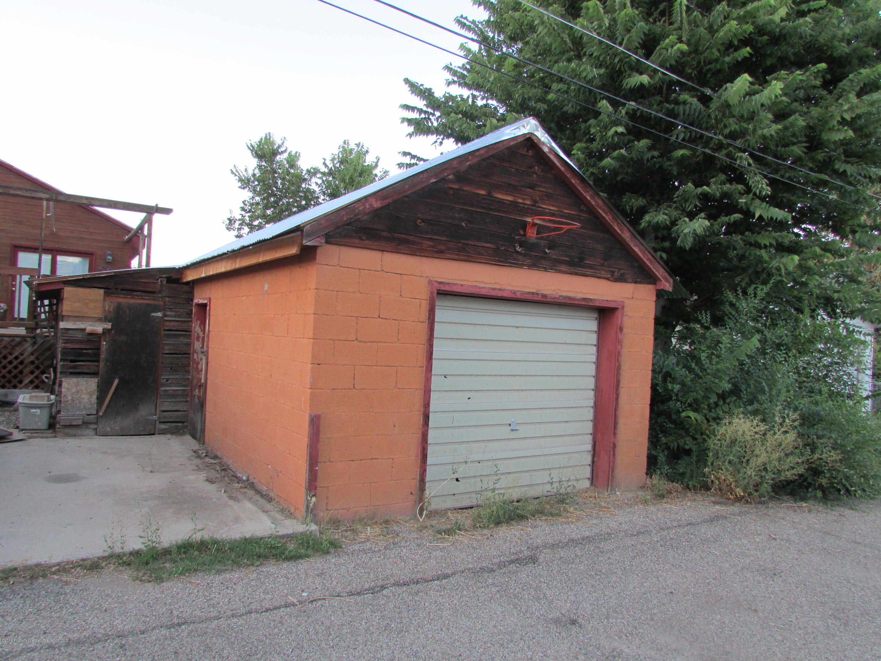819 West 3rd Street Rifle, CO 81650 - Photo 16 of 17 a backyard of a house with garage