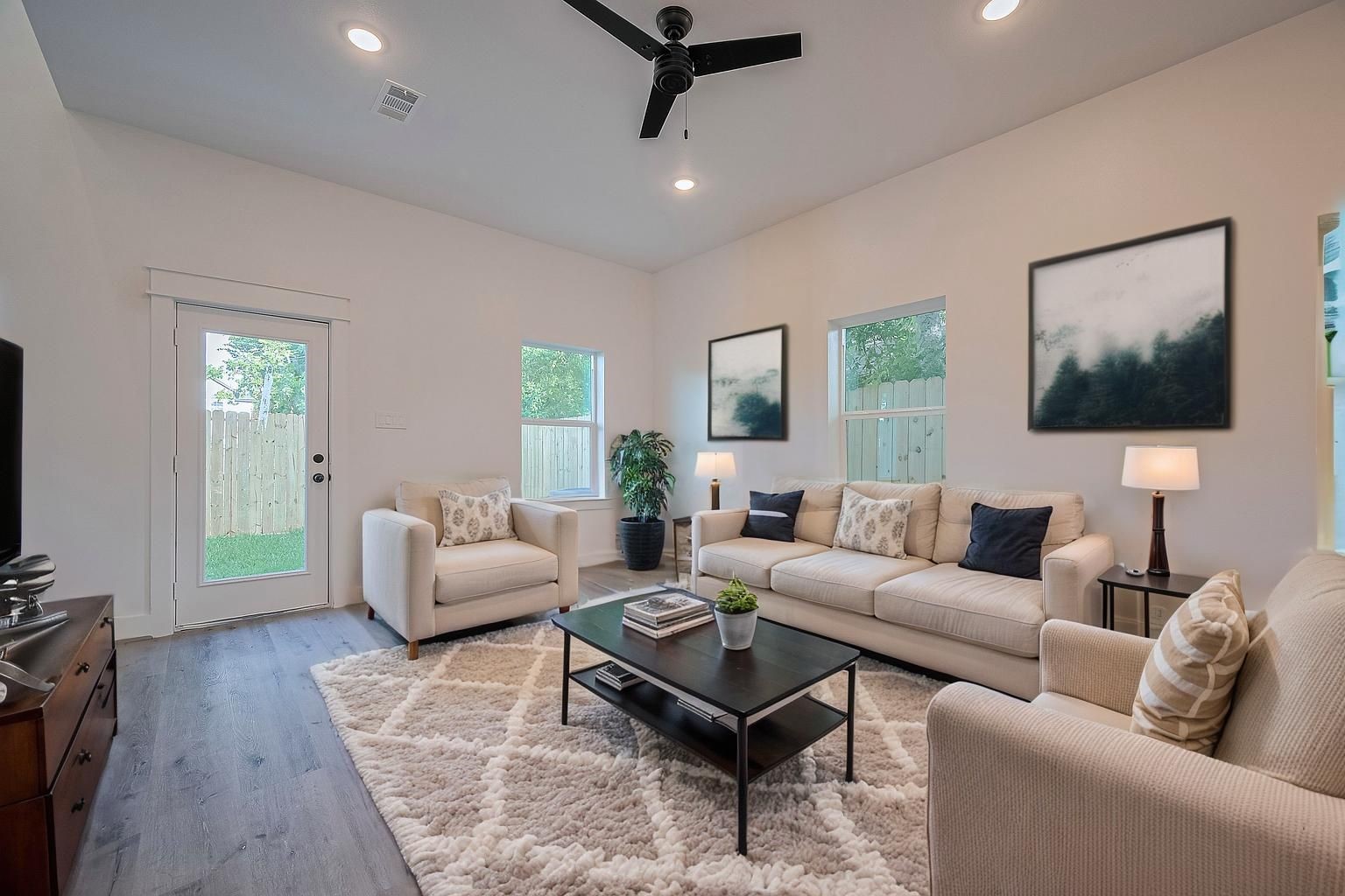 6747 Liverpool Street Houston, TX 77021 - Photo 12 of 18 The main living area is flooded with natural light through oversized windows. **This room has been virtually staged.