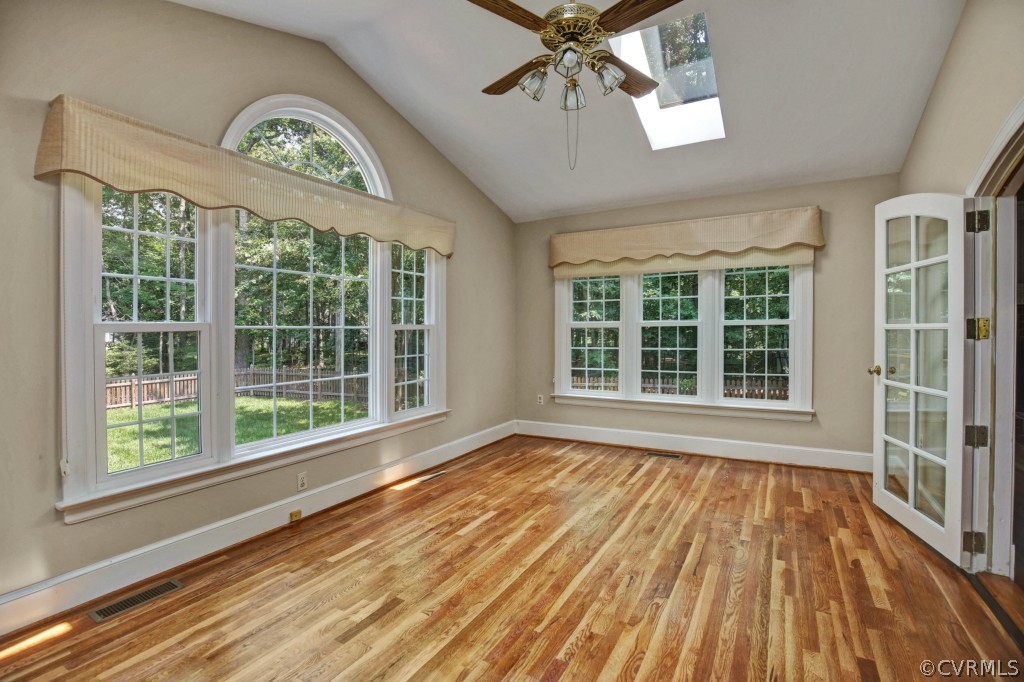14163 Grangewood Road Midlothian, VA 23113 - Photo 12 of 24 a view of an empty room with wooden floor and a window