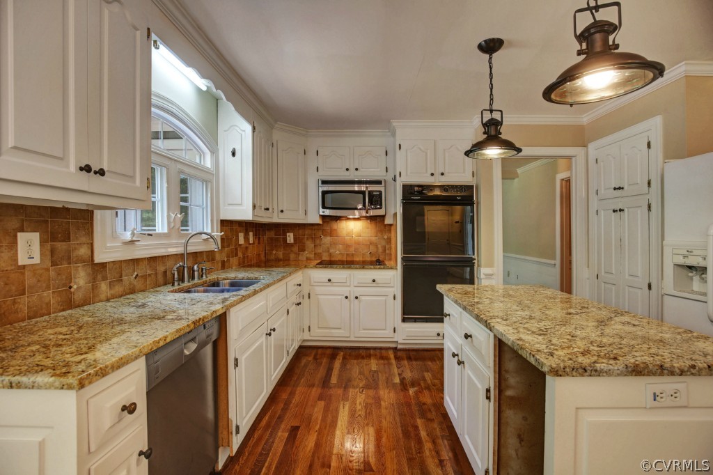 14163 Grangewood Road Midlothian, VA 23113 - Photo 14 of 24 a kitchen with granite countertop kitchen island wooden cabinets and stainless steel appliances