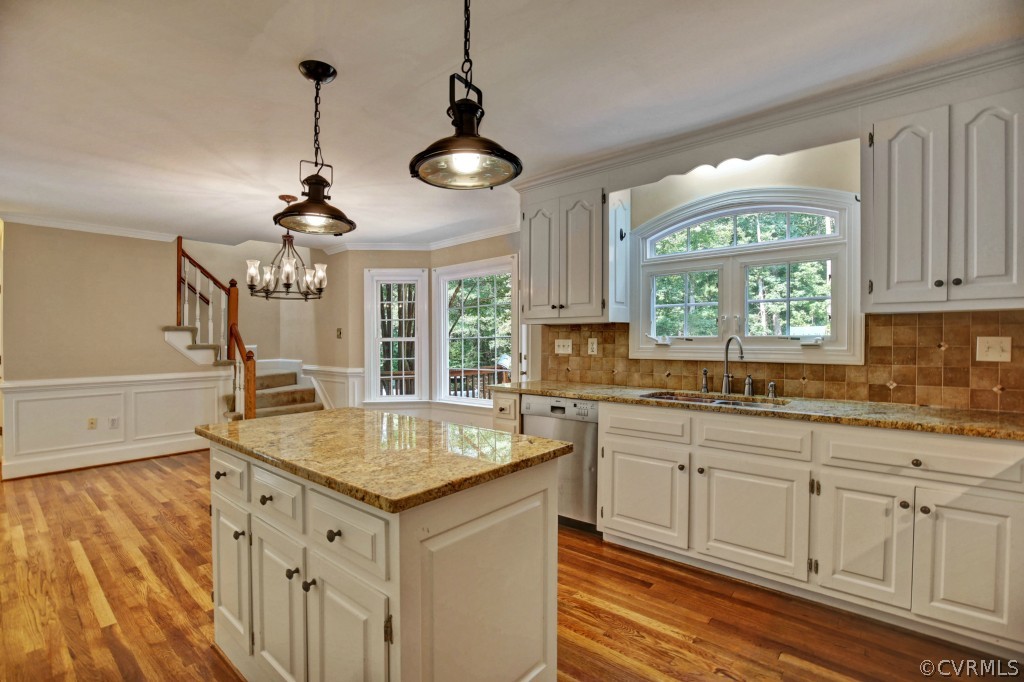 14163 Grangewood Road Midlothian, VA 23113 - Photo 15 of 24 a kitchen with center island and windows