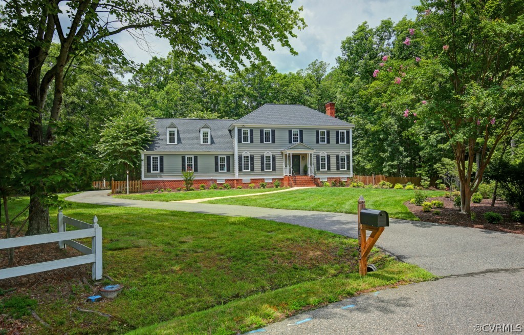 14163 Grangewood Road Midlothian, VA 23113 - Photo 2 of 24 a front view of a house with a yard