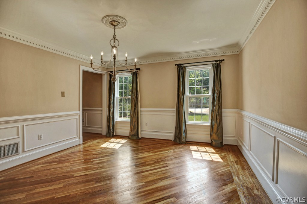 14163 Grangewood Road Midlothian, VA 23113 - Photo 4 of 24 a view of a hallway with wooden floor and staircase