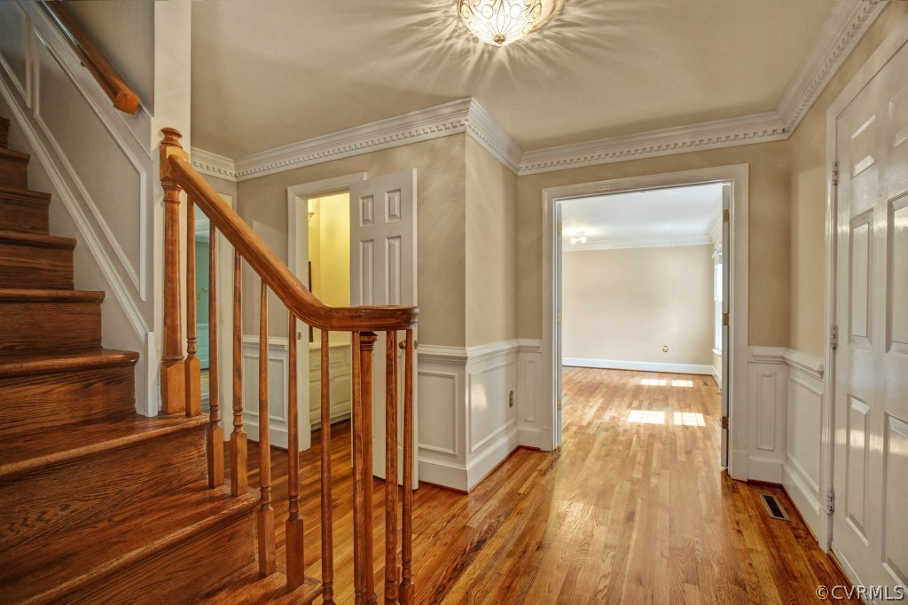 14163 Grangewood Road Midlothian, VA 23113 - Photo 5 of 24 a view of a hallway with wooden floor and staircase