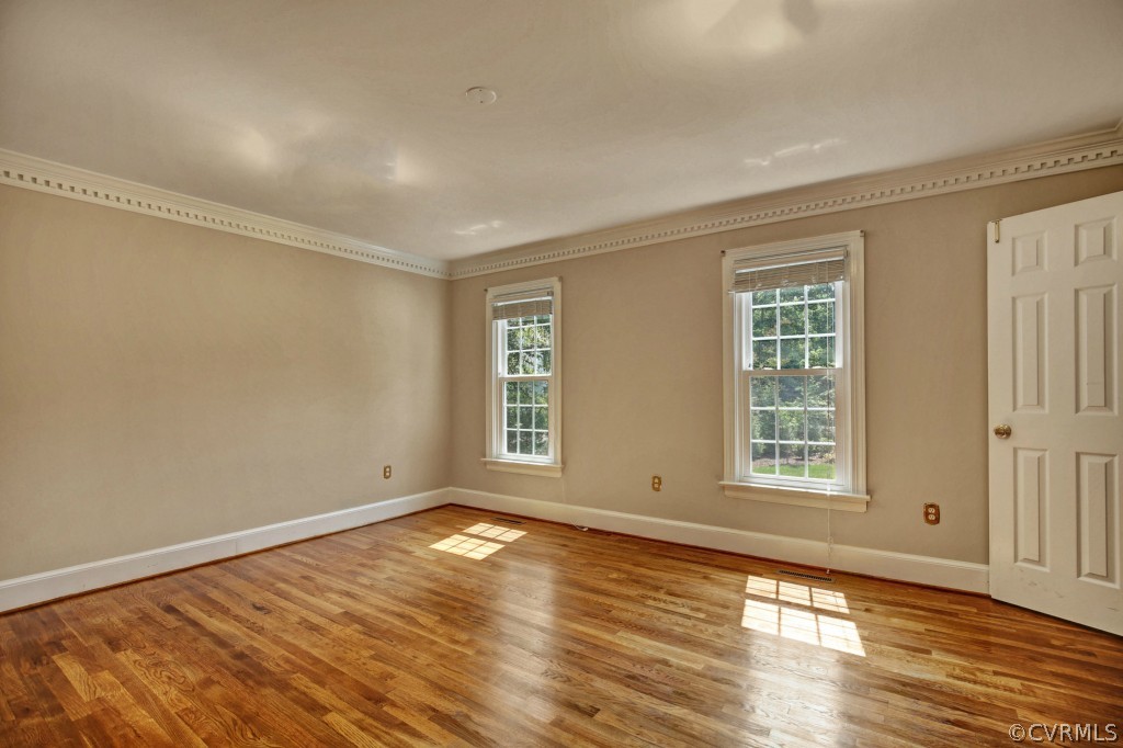 14163 Grangewood Road Midlothian, VA 23113 - Photo 6 of 24 an empty room with wooden floor and windows
